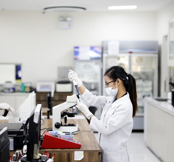 Our clinicians at work in a bright, modern lab
